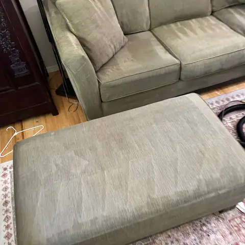 The same olive sofa and ottoman during drying after cleaning