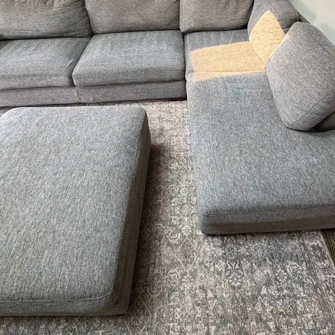 The same gray sectional after cleaning, stains removed