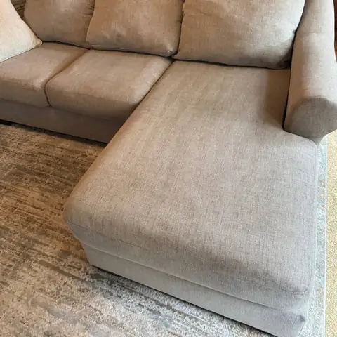The same beige sofa after cleaning, even color restored